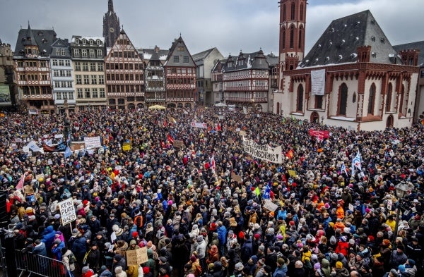 People gather as they protest against the AfD party and right-wing extremism in Frankfurt/Main, Germany, Saturday, Jan. 20, 2024.