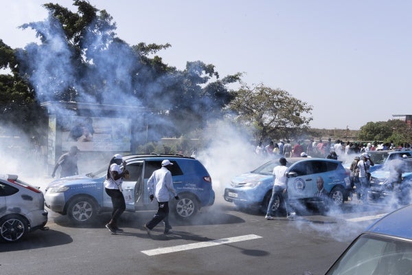 Senegalese riot police lobs tear gas at supporters of opposition presidential candidate Daouda Ndiaye, in Dakar, Senegal, Sunday, Feb. 4, 2024.
