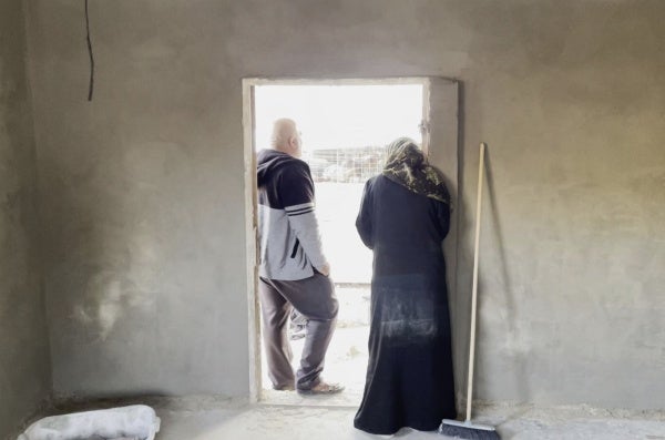 A room under construction by families displaced after attacks by settlers and soldiers from Khirbet Zanuta, in the southern West Bank, November 23, 2023.