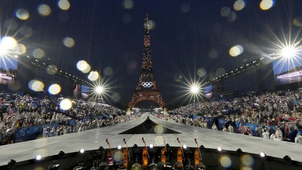 Rain pours down in Paris, France, during the opening ceremony of the 2024 Summer Olympics, Friday, July 26, 2024.