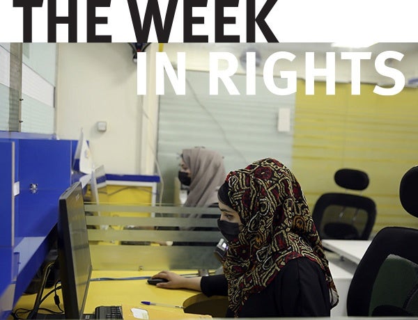 Female students use computers. 