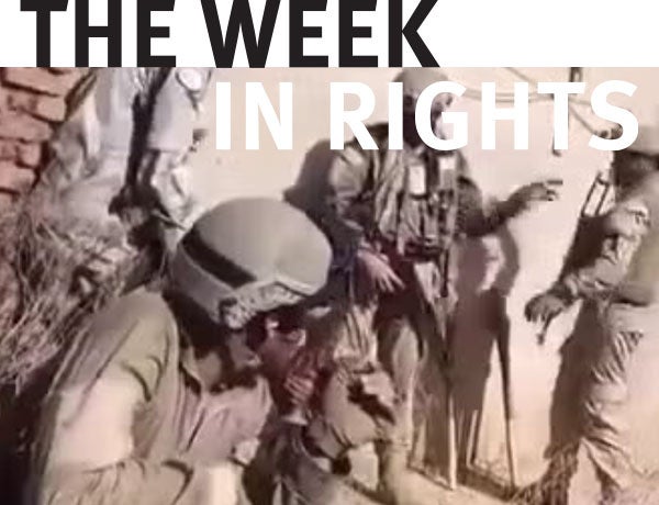 Paramilitary group wields weapons. 