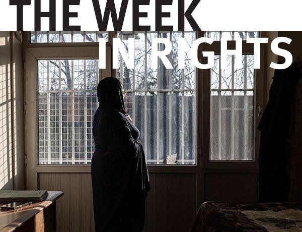 Silhouette of woman standing in classroom. 