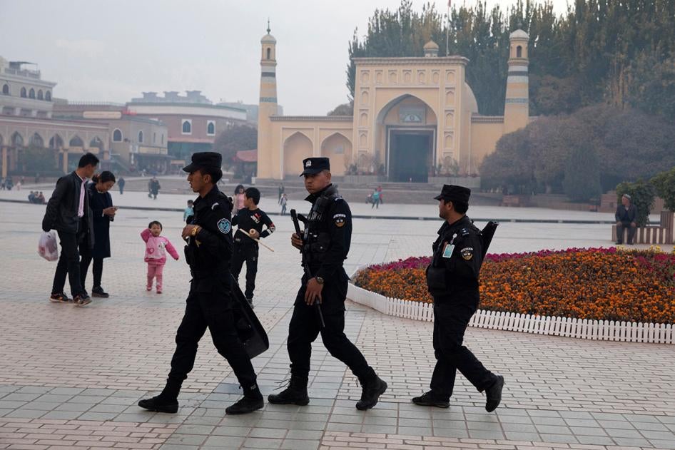 Chinese security personnel patrol near the Id Kah Mosque in Kashgar in China's Xinjiang region, November 4, 2017.