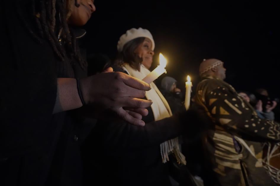 People hold candles at a vigil for Tyre Nichols in Memphis, Tennessee