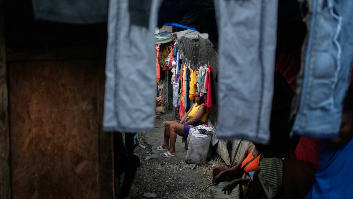 A woman sits in a shelter for families displaced by criminal group violence in Port-au-Prince, Haiti, October 14, 2025.