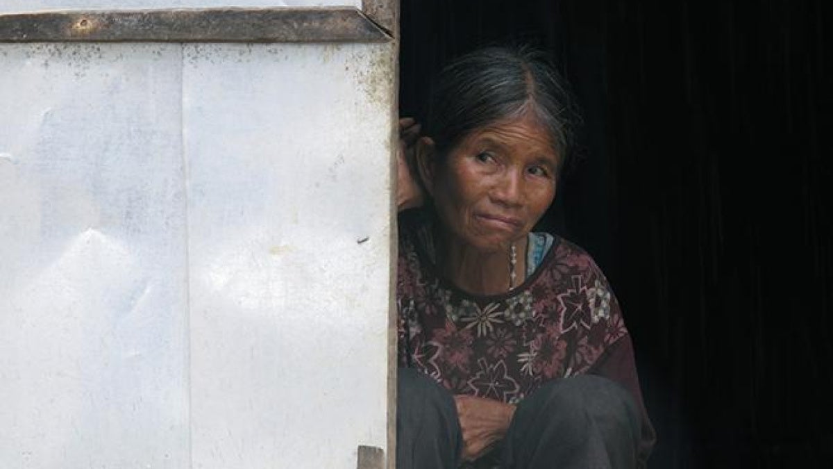 An elderly Dega woman at the door of a house church in Kret Krot village on September 26, 2013