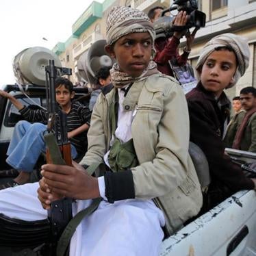 Child soldiers with Houthi fighters hold weapons during a demonstration in Sanaa on March 13, 2015.