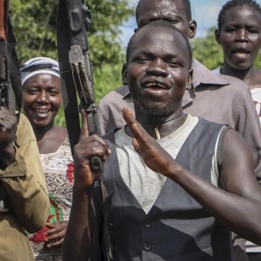 FILE: Opposition soldiers chant "Viva IO", meaning "long live the opposition", during a visit in August 2019 by a ceasefire monitoring team, at an opposition military camp near the town of Nimule in Eastern Equatoria state, South Sudan. 