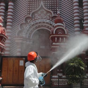 A Sri Lankan firefighter sprays disinfectants near a mosque in Colombo, Sri Lanka