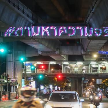 Thai activists use laser projectors to display the message “Searching for the Truth,” in remembrance of the 2010 military crackdown on the “Red Shirts” protest, May 2020.