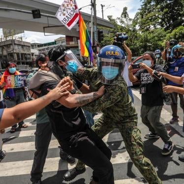 Police arrest protesters during a Pride march in Manila, Philippines, June 26, 2020.