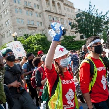 Medics and volunteers march with thousands of people gathered around Lafayette Square, in Washington, DC, to protest the death of George Floyd. [June?] 6, 2020.