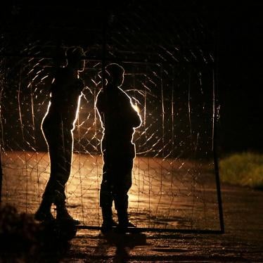 Armed Zimbabwean prison guards are seen at the entrance of Chikurubi prison on the outskirts of Harare, January 30, 2019.