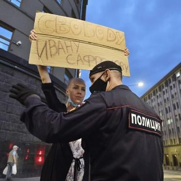 Mariya Starikova stands in front of the FSB building in Moscow with a placard reading “Freedom to Ivan Safronov”, July 7, 2020.