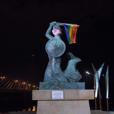 The Mermaid of Warsaw statue is seen holding the LGBT rainbow flag and wearing a pink mask with the anarcha-queer symbol in Warsaw, Poland July 29, 2020 in this image taken from social media.