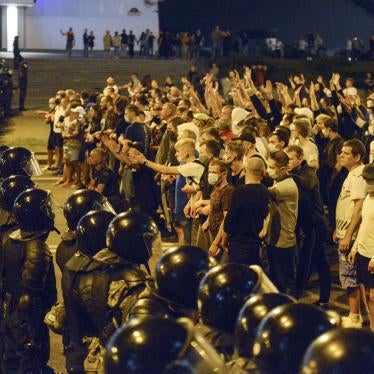 People argue with police during a rally after the Belarusian presidential election in Minsk, Belarus, late Sunday, Aug. 9, 2020.