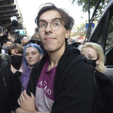 Activist Malgorzata Szutowicz, center, known as Margot, before being arrested in Warsaw, Poland,