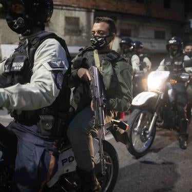National Guard soldiers and municipal police ride through the neighborhood of Petare in Caracas, Venezuela, on August 7, 2020, patrolling the area to make sure residents are complying with COVID-19 regulations.