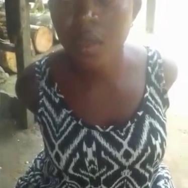  A screenshot of the video showing Confort Tumassang being interrogated and threatened by armed separatists before her killing, August 11, 2020, Muyuka, South-West region, Cameroon  