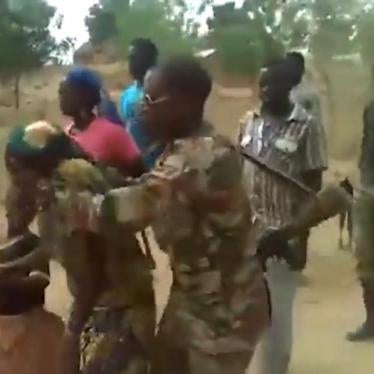 A screenshot of the video showing soldiers taking a woman and a child to the place where they would be later killed in Zelevet, Far North region, Cameroon, 2015.