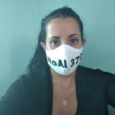 Journalist Camila Acosta wears a facemask saying “no to Decree 370,” a 2019 law curtailing free speech in Cuba, on August 1, 2020.