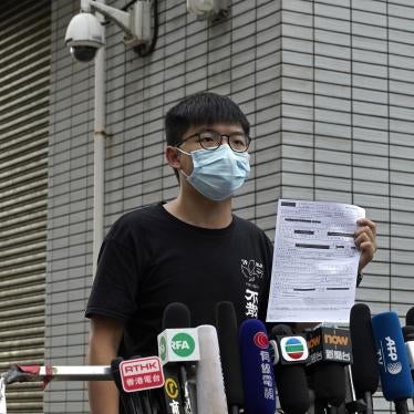 Hong Kong pro-democracy activist Joshua Wong displays a bail paper outside Central Police Station in Hong Kong, Thursday, Sept. 24, 2020. 