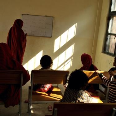 A woman prisoner teaches fellow inmates and their children at a central jail in Mardan, Pakistan, November 8, 2018.