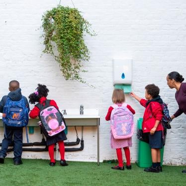 Students wash their hands as they arrive on the first day back to school at Charles Dickens Primary School in London, England, September 1, 2020.