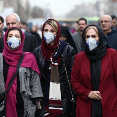 Iranian women wearing masks to protect themselves from the coronavirus walk at the Grand Bazaar in Tehran on February 20, 2020.