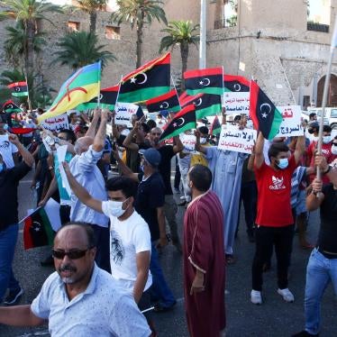 Protesters chant slogans during anti-corruption demonstrations in the capital Tripoli’s Martyrs' Square on August 25, 2020.