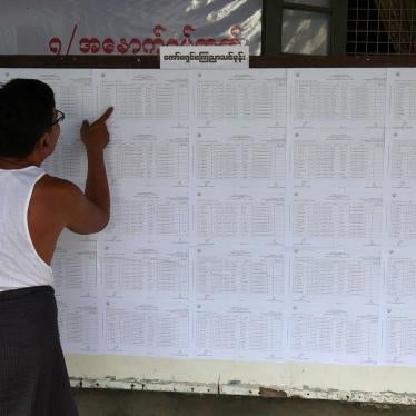 A resident checks voting lists at an administrative office in Yangon ahead of Myanmar’s upcoming general election, July 25, 2020. 