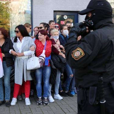 Women stand in front of a police officer during an opposition rally to protest the official presidential election results in Minsk, Belarus, September 19, 2020.