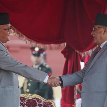 Nepal's Prime Minister Khadga Prasad Oli, left, shakes hand with former Maoist leader Pushpa Kamal Dahal, February 15, 2018. In May 2018, Oli and Dahal parties merged their parties to form the current ruling party, the Communist Party of Nepal. 
