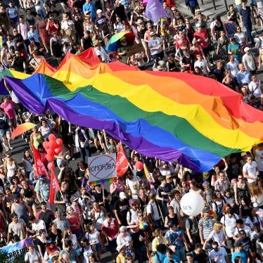People march with a giant rainbow flag from the parliament building in Budapest during the lesbian, gay, bisexual and transgender (LGBT) Pride Parade on July 6, 2019.