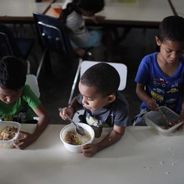 Children eat lunch at Madre Asunción's community kitchen, which is ran by the NGO Alimenta La Solidaridad, on October 9, 2019 in Petare, Caracas, Venezuela.