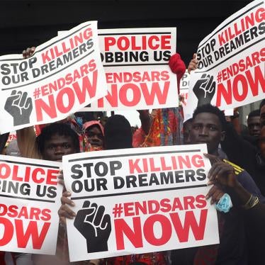 Demonstrators carry banners during a protest over alleged police brutality, in Lagos, Nigeria October 14, 2020.