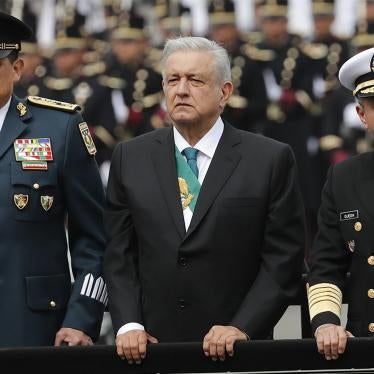 Mexican President Andrés Manuel López Obrador, center, stands with Secretary of Defense Luis Crescencio Sandoval, left, and Secretary of the Navy, Vidal Francisco Soberón, in an open military vehicle during the Independence Day military parade in the main plaza, the Zócalo, in Mexico City.