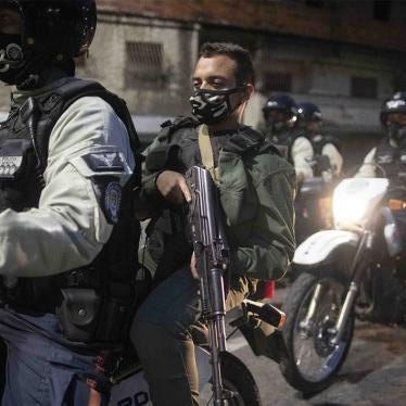 National Guard soldiers and municipal police ride through the neighborhood of Petare in Caracas, Venezuela, on August 7, 2020, patrolling the area to make sure residents are complying with COVID-19 regulations.