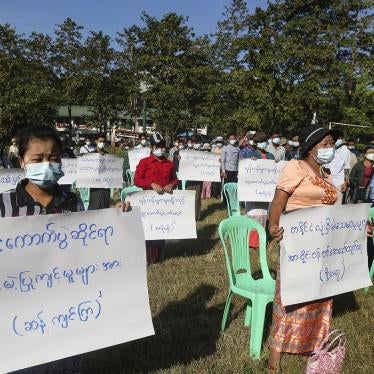 Protesters hold placards that read "Oppose unfair action of election! Investigate voting fraud around the country!" in a rally to condemn the November 8 general election results in Yangon, Myanmar on Friday, November 20, 2020.