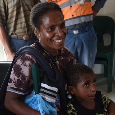 Maria Ponde and her 6-year-old daughter Warapnong waiting to receive a polio vaccination in a mobile clinic in Mount Hagen in the Western Highlands, Papua New Guinea, November 2018.