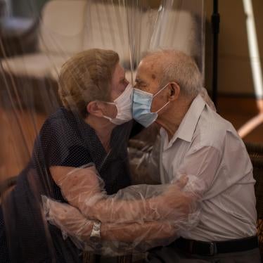 An 81-year-old woman and her 84-year-old husband kiss through plastic, after remarking that it was the longest time they had spent apart in 59 years of marriage, to prevent the spread of Covid-19 at a nursing home in Barcelona, Spain, June 2020.  