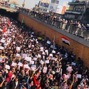 Protesters marching in Al-Tahrir Square Tunnel in Baghdad, Iraq.