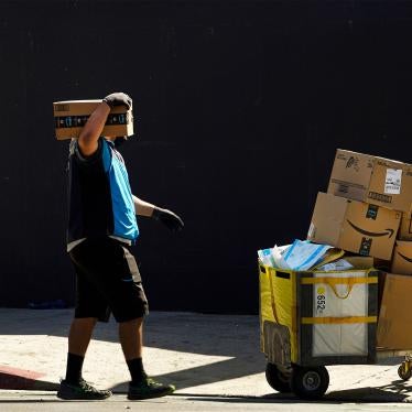 An Amazon worker delivers boxes in downtown Los Angeles, California, October 1, 2020. 