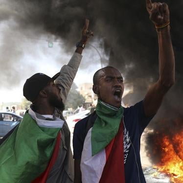 A demonstrator gives the victory sign during a protest in Khartoum, Sudan, December 19, 2020.