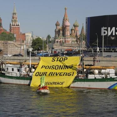 Members of the Russian branch of the environmental group Greenpeace display a protest banner in downtown Moscow on Thursday, May 20, 2010. 