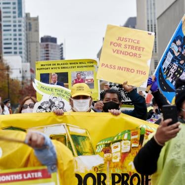 Street vendors and supporters march across Brooklyn Bridge during a rally in the Brooklyn borough of New York City, November 12, 2020.