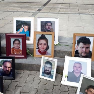 Photos of Syrians who have been detained or disappeared set up by Families for Freedom, as part of a protest in front of the court in Koblenz, July 2, 2020. 