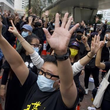 Supporters protest outside a court in Hong Kong where police brought 47 pro-democracy activists, March 1, 2021.