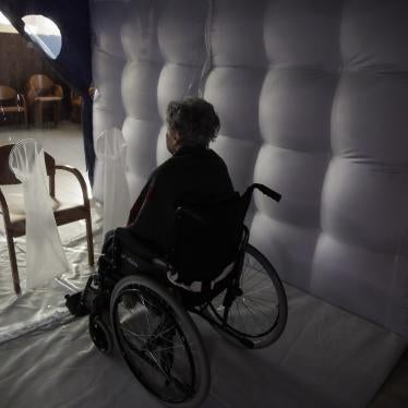 Caterina Salvi, 90, waits for a visitor inside a protective inflatable plastic tunnel at the Martino Zanchi nursing home in Alzano Lombardo, northern Italy, February 24, 2021. 